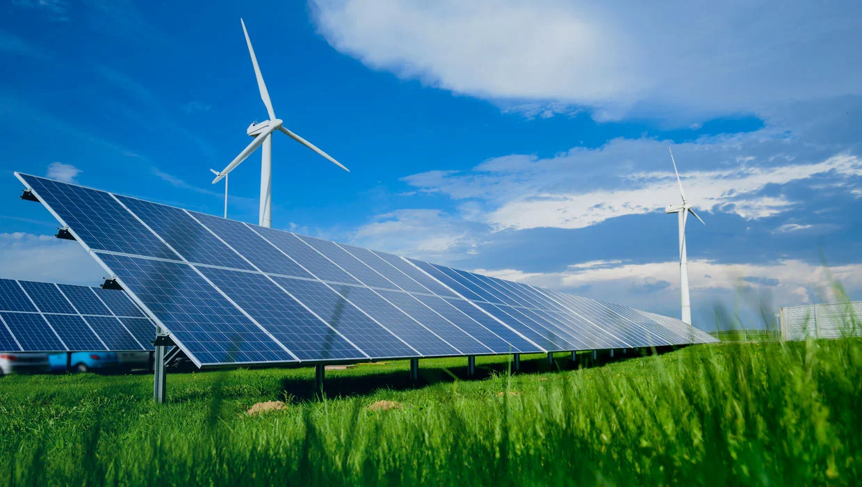 commercial energy solutions - solar panels, wind turbine in a field Devon